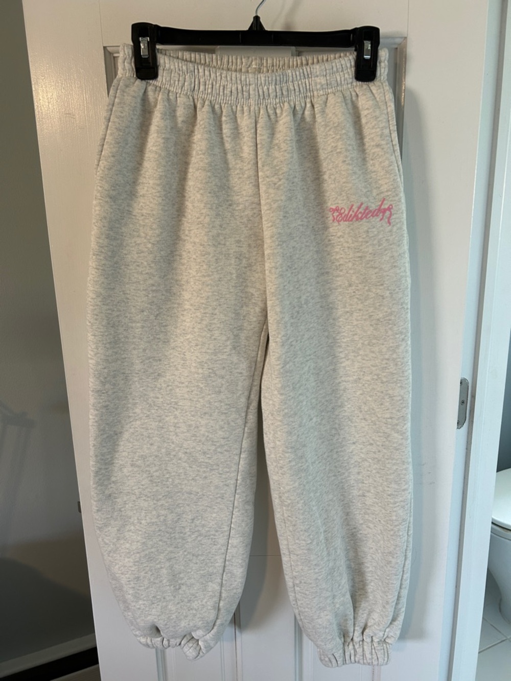 Edikted Heather Gray Sweatpants with Pink Script Logo
